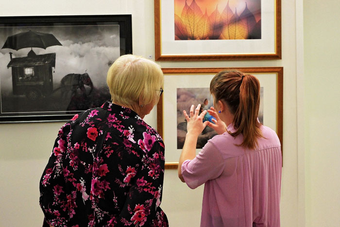 Bsrag visitors discussing artwork