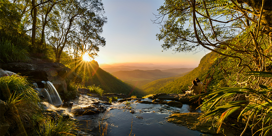 Photograph of sunset and hikers, Luke Hammer Walk With Me exhibition