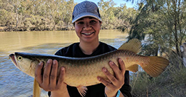 Skekaylah holding her catch of the day at Theodore Fishing Competition