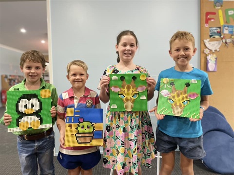 Kids posing with their presents